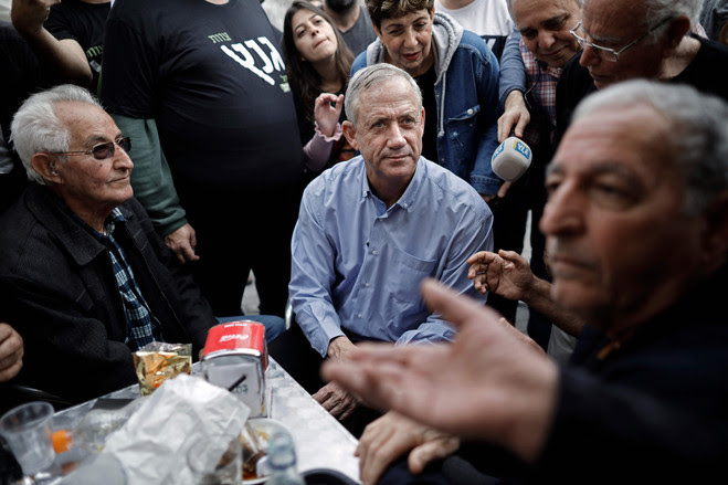 Benny Gantz , center, a retired Israeli general, mingles with people during an electoral campaign tour in the city of Rishon Letzion, south of the coastal city of Tel Aviv, on Feb. 1.