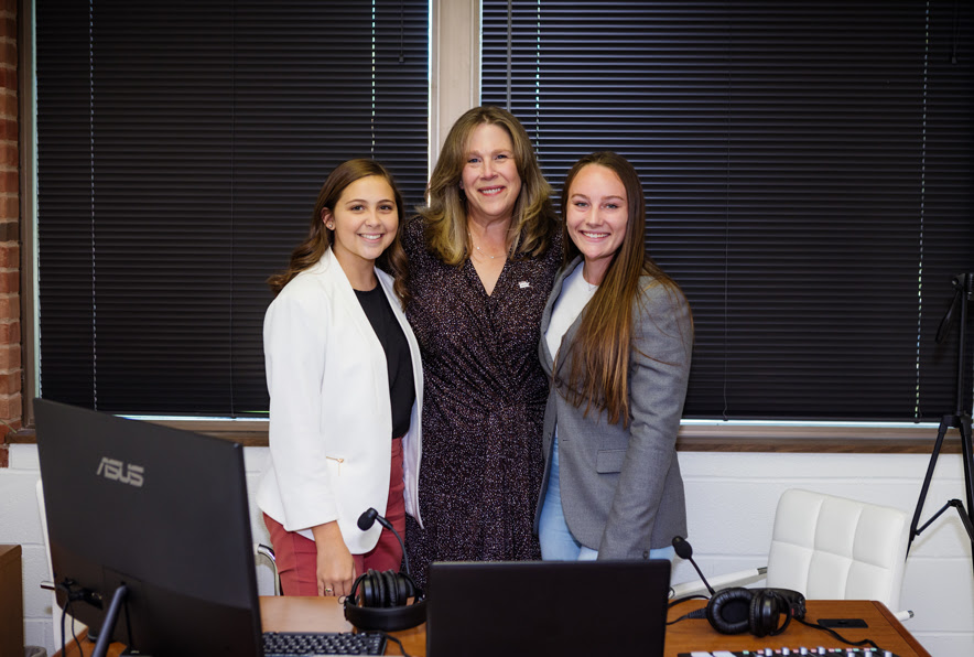Photo of Hailey and Kennedy with President Melissa J. Baumann from thier podcast