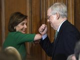 House Speaker Nancy Pelosi of Calif., left, and Senate Majority Leader Mitch McConnell of Ky., right, bump elbows as they attend a lunch with Irish Prime Minister Leo Varadkar on Capitol Hill in Washington, Thursday, March 12, 2020. (AP Photo/Susan Walsh)