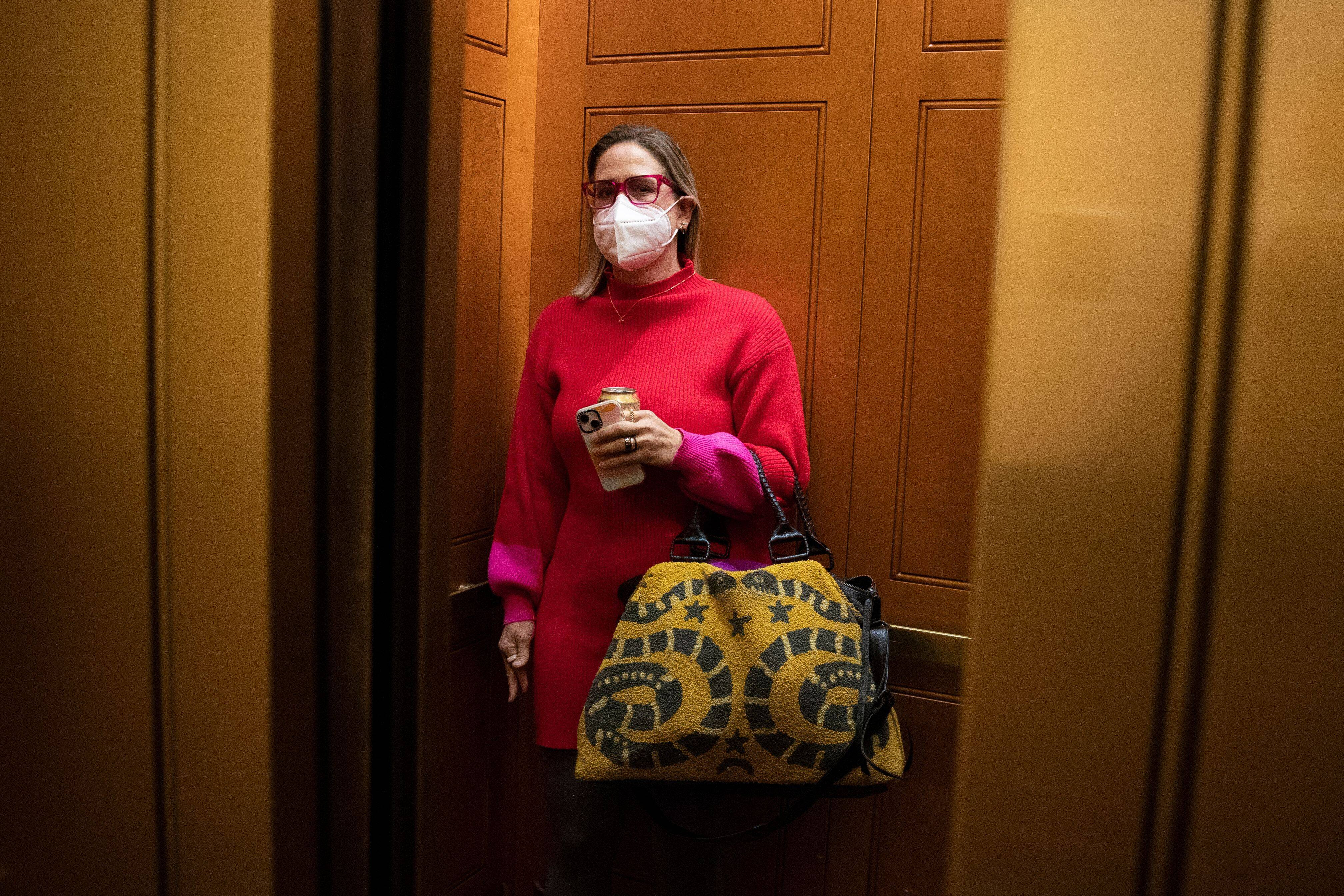 Sen. Kyrsten Sinema, a Democrat from Arizona, enters an elevator on Capitol Hill last week. (Michael Reynolds/EPA-EFE/Shutterstock)
