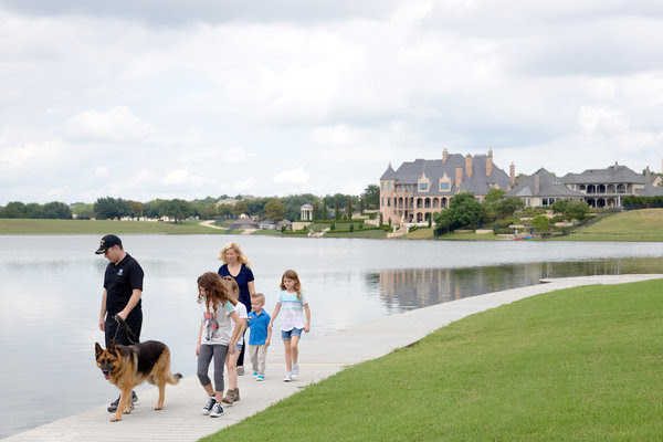 Paul and Brenda Chabot with their four children as they walked their dog around their new neighborhood in McKinney, Tex.