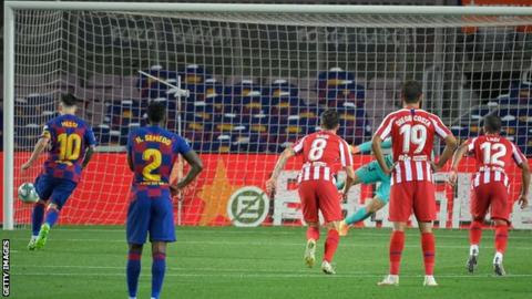 Lionel Messi scores a penalty