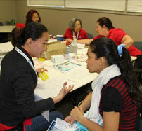 MRC volunteer provides health screening.