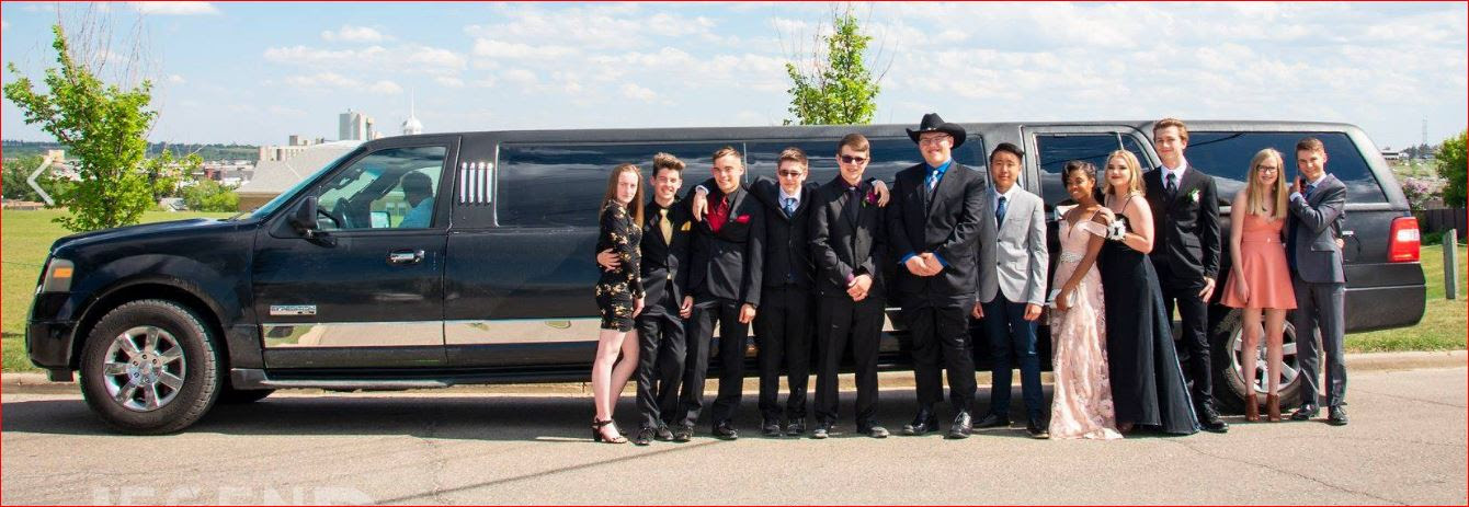 Wedding Party standing in front of a black Expedition Limousine