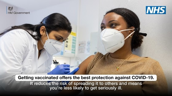 Woman receives vaccination for protection against Covid-19