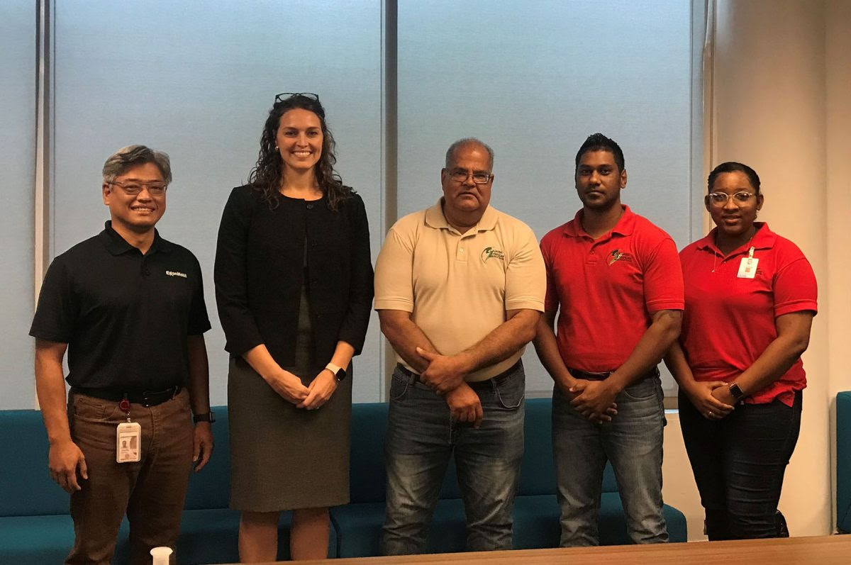 From left to right are Aryoko Dwinanto, Katrina Masters, representing Exxon Guyana, and Richard Isava, Ganesh Jaikaran, and Delecia George representing the Guyana Americas Merchant Bank (GAMBI photo)