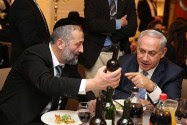 Aryeh Deri and Benjamin Netanyahu at a recent party.