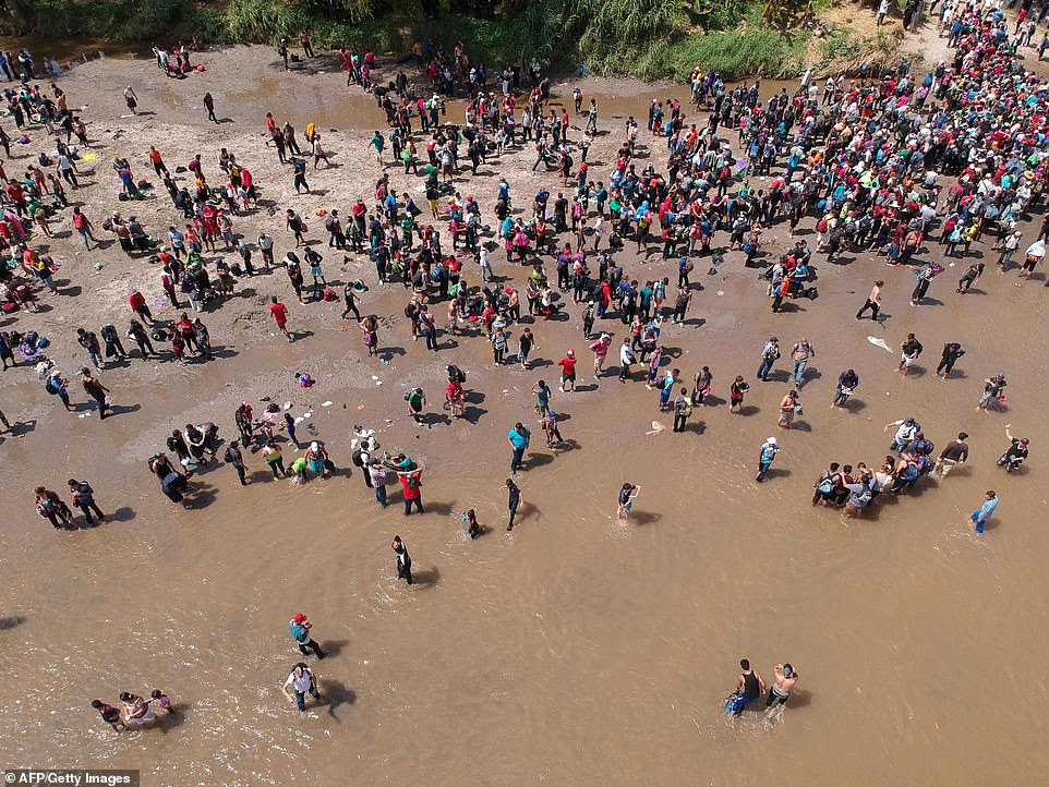 Aerial view showing migrants reaching Mexico after crossing the Suchiate River from Tecun Uman in Guatemala to Ciudad Hidalgo in Mexico