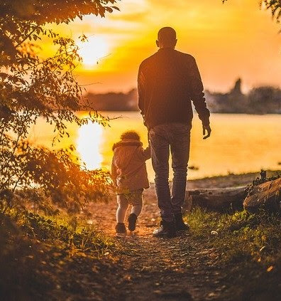 Dad walking with daughter