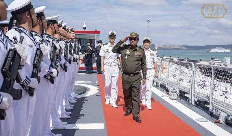 Cambodia’s former Defense Minister Tea Banh salutes Chinese sailors during his visit to two Chinese warships docked at the Ream naval base in Cambodia, Dec. 3, 2023. (Tea Seiha via Facebook)