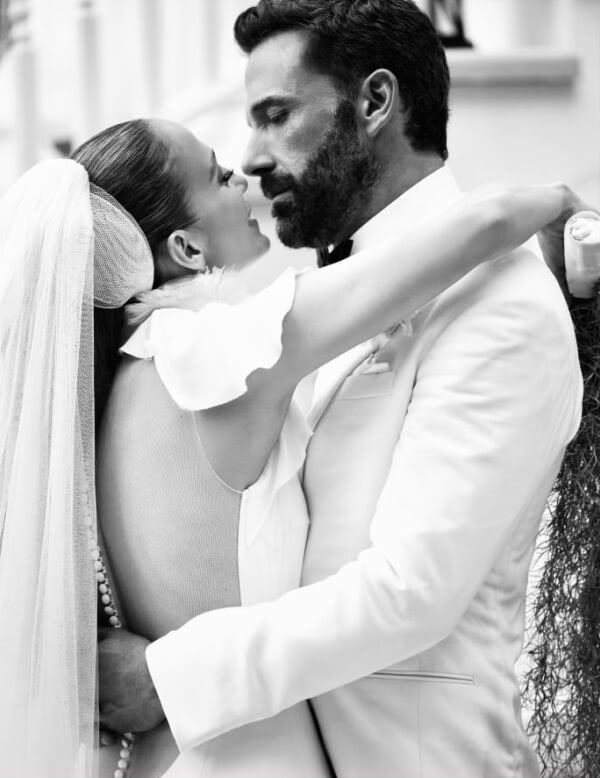 Jennifer and Ben embracing on their wedding day