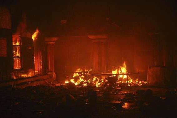 A Hindu temple burns after it was attacked in Larkana, southern Pakistan's Sindh province, March 15, 2014. REUTERS-Faheem Soormro