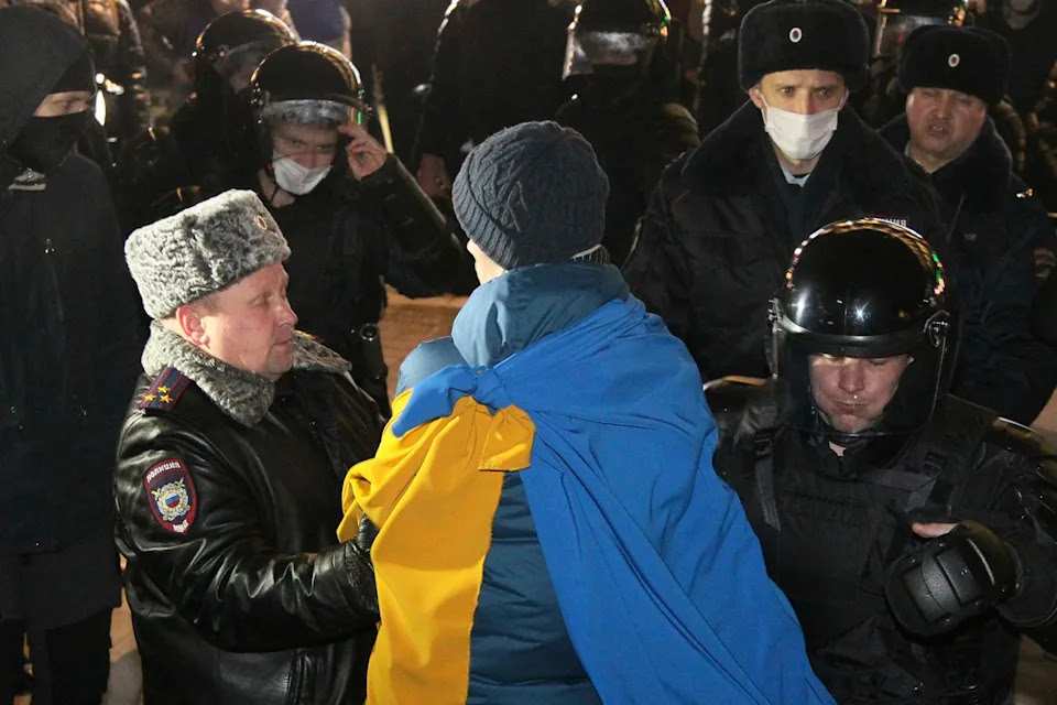 Police officers detain a protester in Nizhny Novgorod, Russia, Thursday, Feb. 24, 2022. Hundreds of people gathered in the center of Moscow, St. Petersburg, Nizhny Novgorod and other Russian cities on Thursday, protesting against Russia's attack on Ukraine. Many of the demonstrators were detained. Similar protests took place in other Russian cities, and activists were also arrested. (AP Photo/Dmitri Lovetsky)