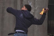 Arab youth throwing a firebomb. (archive)