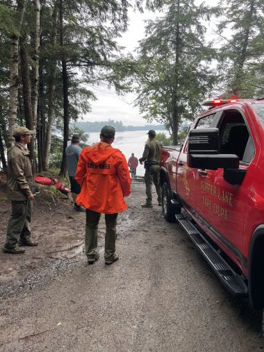 Rangers, firefighters, and other personnel responding to campground
