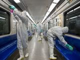 Workers disinfect subway trains against coronavirus in Tehran, Iran, in the early morning of Tuesday, Feb. 25, 2020. Iran&#39;s government said Tuesday that more than a dozen people had died nationwide from the new coronavirus, rejecting claims of a much higher death toll of 50 by a lawmaker from the city of Qom that has been at the epicenter of the virus in the country. (Sajjad Safari/IIPA via AP)