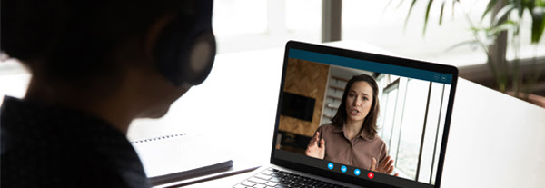 Lady on laptop watching training