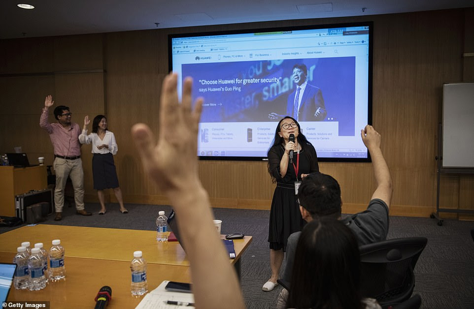 Huawei workers from the Public Affairs and Communications department take part in a training session