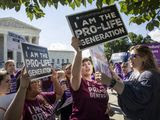 Pro-life and anti-abortion advocates demonstrate in front of the Supreme Court early Monday, June 25, 2018. The justices are expected to hand down decisions today as the court&#39;s term comes to a close. (AP Photo/J. Scott Applewhite)