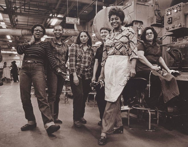 Russ Marshall's "Press Operators, GM Fisher Body Trim Plant, Fort Street, Detroit Michigan" at the DIA through June 27.