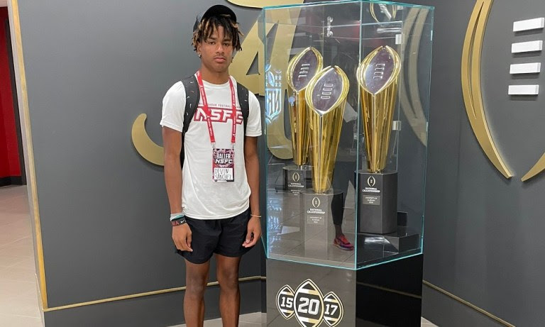 Devin Sanchez poses with alabama trophies