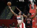 Washington Wizards guard Bradley Beal (3) goes to the basket next to Chicago Bulls forward Thaddeus Young (21) during the first half of an NBA basketball game, Tuesday, Feb. 11, 2020, in Washington. (AP Photo/Nick Wass)