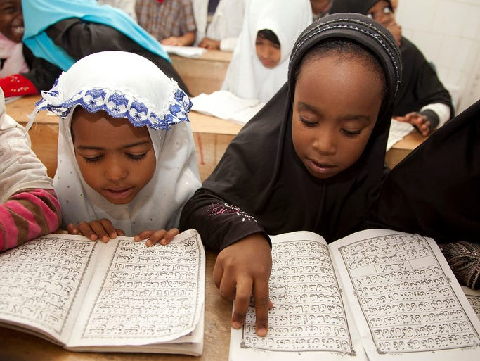 Children recite passages from the Quran at an Islamic school in Nairobi, Kenya.