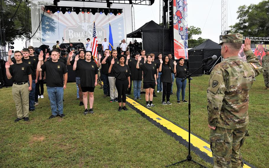 Maj. Gen. David J. Francis, U.S. Army Aviation Center of Excellence and Fort Rucker commander, leads future soldiers as they recite the Oath of Enlistment on June 30, 2022. 