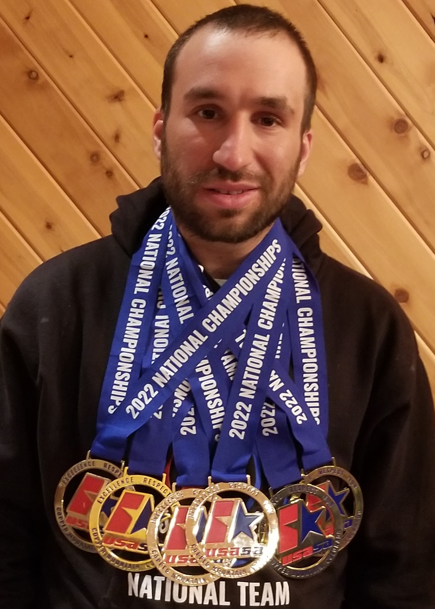 Zachary Elder wearing his six medals