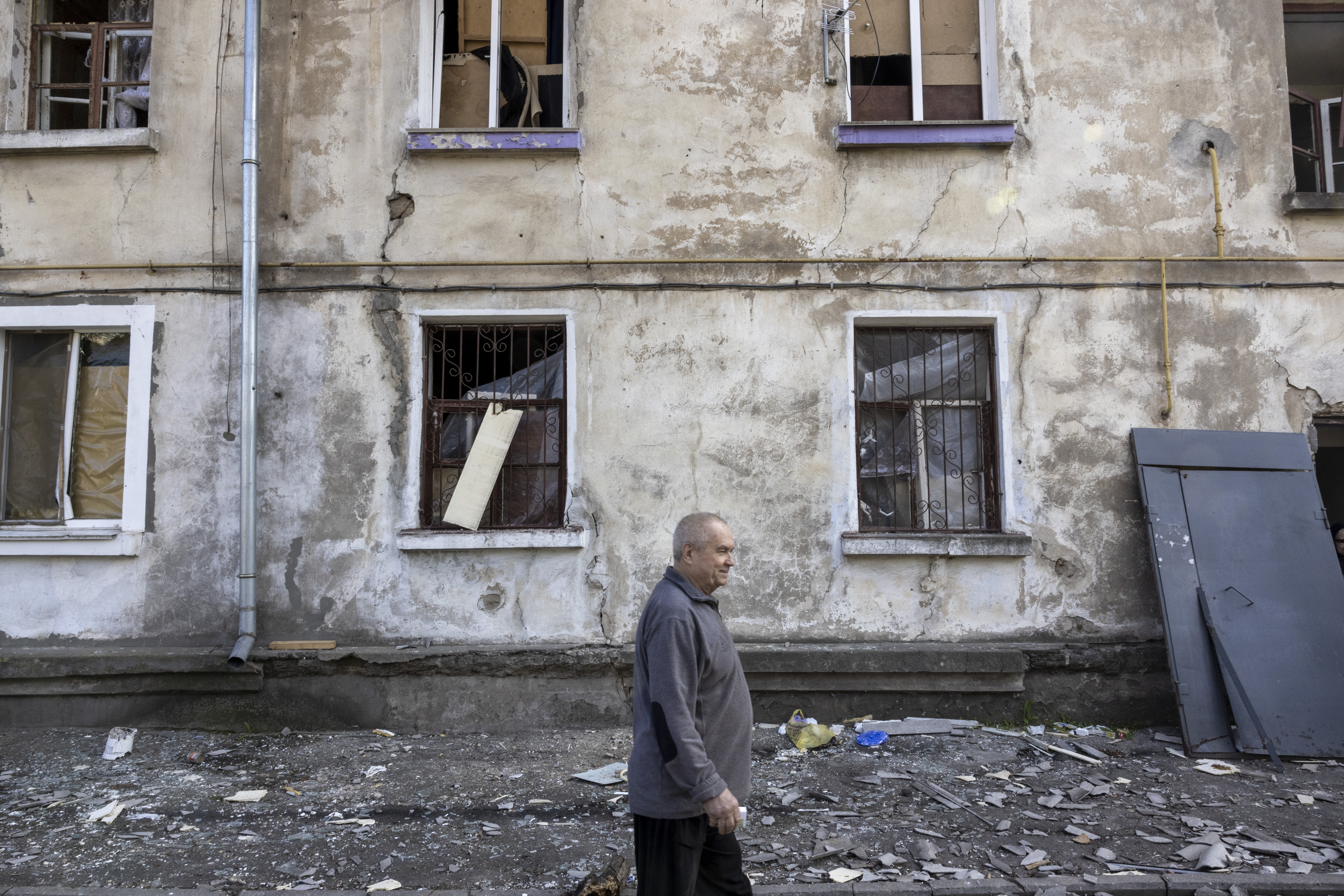 Badly damaged residential homes in an industrial area of Mykolaiv.