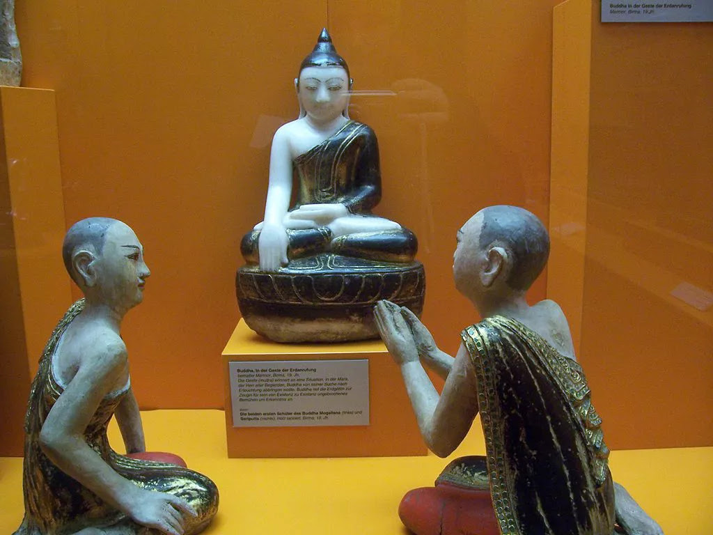Statues of Buddha, Mogallana and Sariputta in a museum.