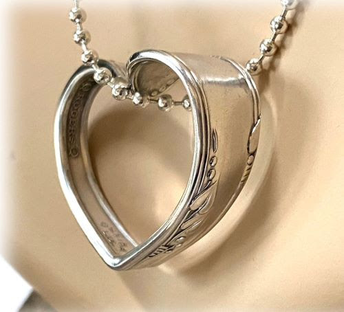 Heart-shaped pendant made from upcycled flatware