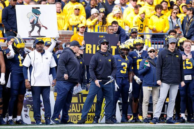 Michigan Wolverines coaching staff on the sideline