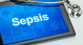 photo of tablet device with word sepsis on screen