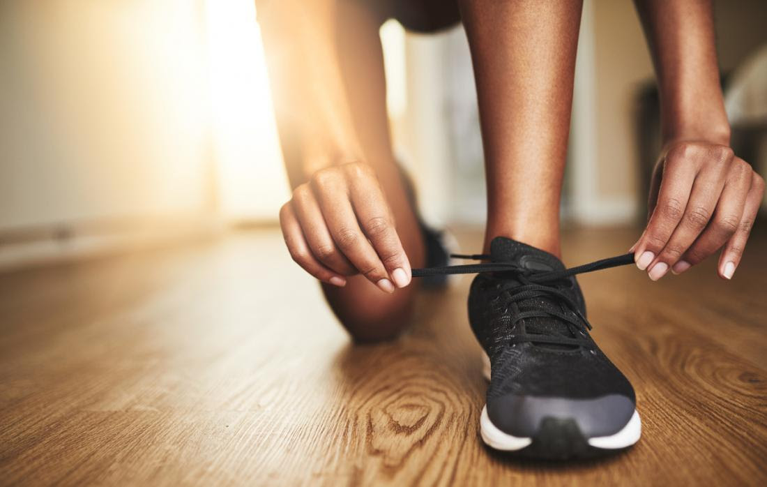 lacing up running shoes