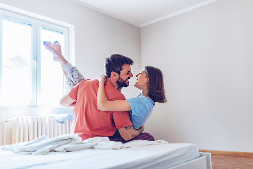 Romantic Couple In Bedroom Stock Photo - Download Image Now - 20-29 Years,  Adult, Adults Only - iStock