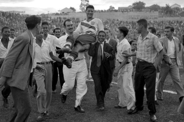 A joyful Joe Gaetjens is carried from the field by adoring fans in Belo Horizonte, Brazil, at the 1950 World Cup. Born in Haiti, Gaetjens played for the US team and scored the winning (and) only goal during America's match with England.