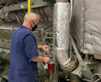 Photo of oiler in ferry engine room