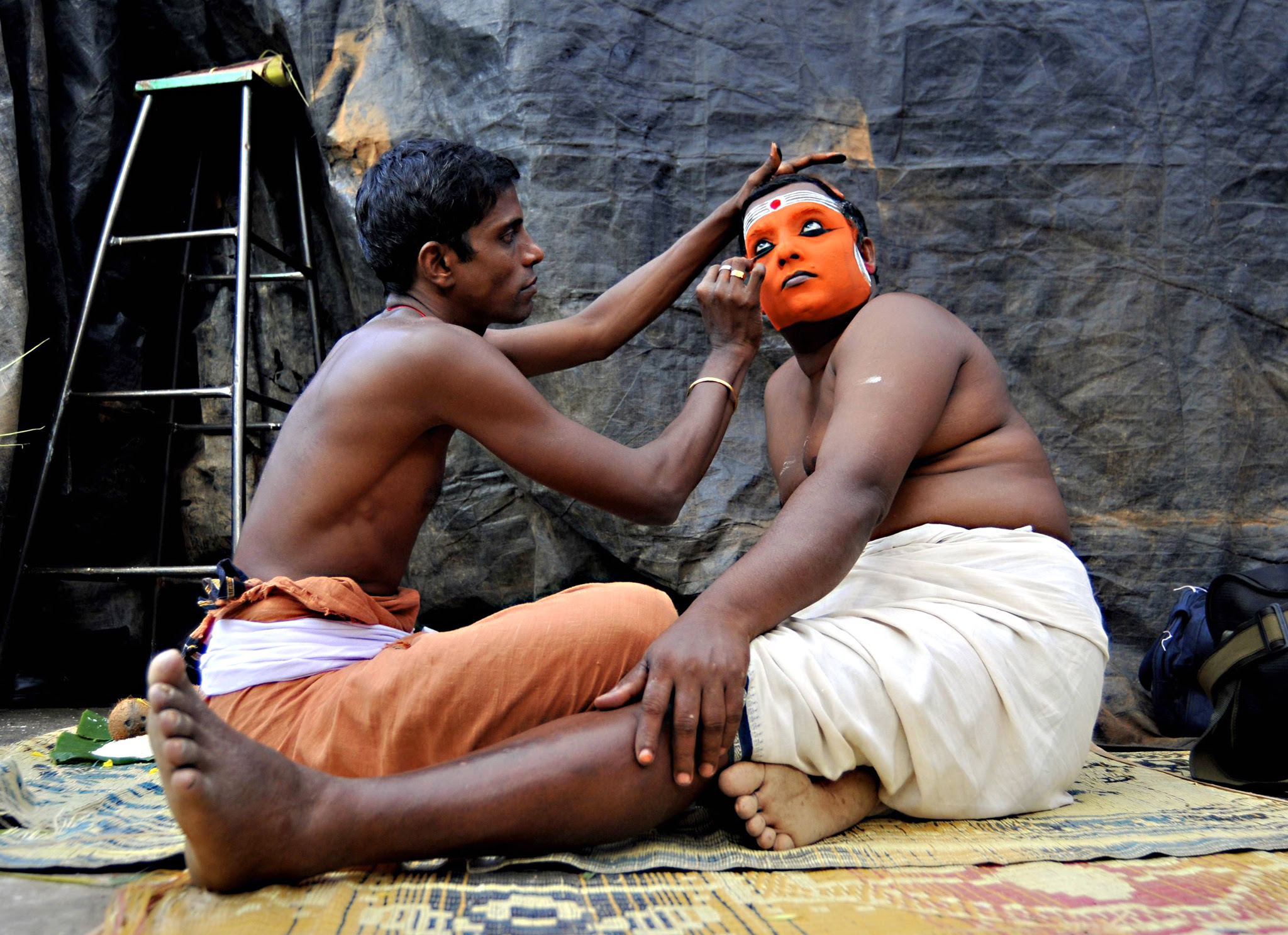 Artist has his face painted to resemble Hindu god Shasthappan before performing during the Theyyam ritual in Somwarpet...An artist has his face painted to resemble Hindu god Shasthappan before performing during the Theyyam ritual in Somwarpet town in the southern Indian state of Karnataka March 16, 2015. Theyyam is a form of worship and is celebrated mostly in southern parts of the country. Picture taken March 16, 2015. REUTERS/Abhishek N. Chinnappa (INDIA - Tags: ANNIVERSARY RELIGION SOCIETY)