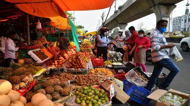  People crowd near Erragadda Rythu Bazar to buy fruits, during the four-hour relaxation, in Hyderabad on May 14, 2021. 