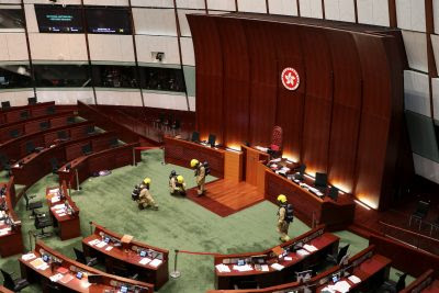Firefighters wearing gas masks check the chamber of the Legislative Council in Hong Kong, China, 28 May 2020 (Photo: REUTERS/Jessie Pang). Firefighters wearing gas masks check the chamber of the Legislative Council in Hong Kong, China, 28 May 2020 (Photo: REUTERS/Jessie Pang).