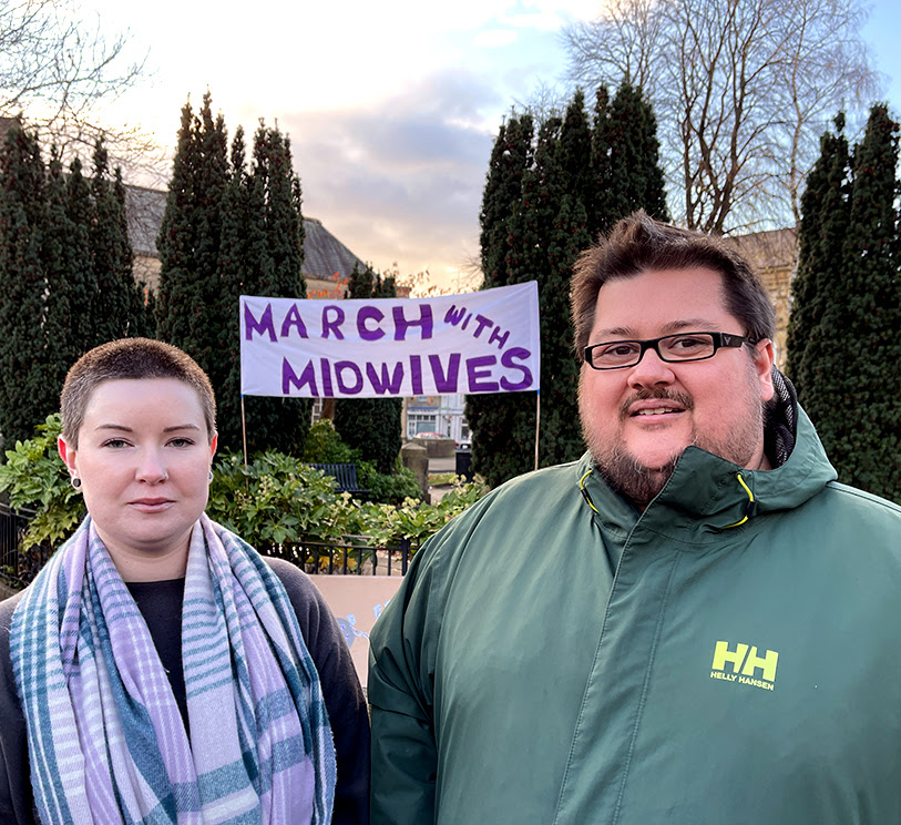 A photo of Cllr Sarah Hall and Cllr Andy Fewings with a 'March with Midwives' banner