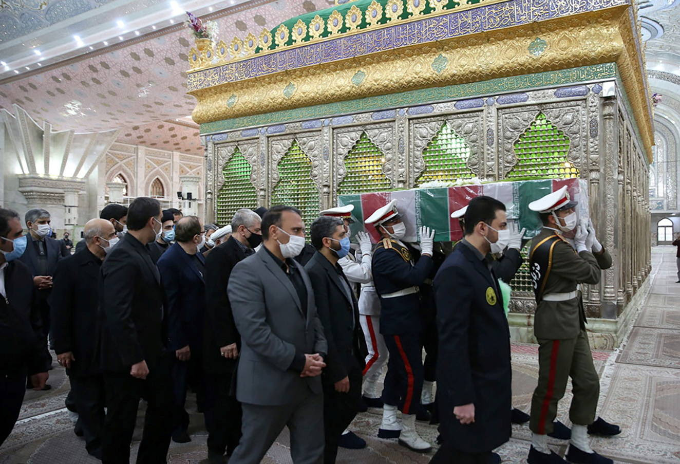 Members of the Iranian forces carry the coffin of nuclear scientist Mohsen Fakhrizadeh at the Imam Khomeini's Shrine in Tehran on Nov. 29. (Khodabakhsh Malmir/WANA/Reuters)