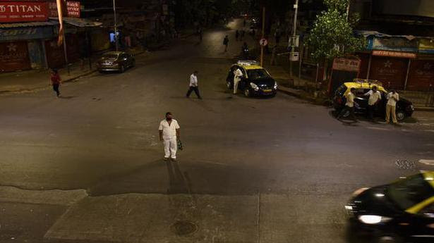  A view of the partially deserted road during a night curfew ahead of the scheduled weekend lockdown imposed by Maharashtra government in Mumbai on April 9, 2021. 