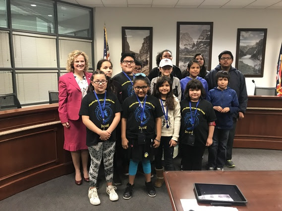 The State Superintendent with a group of elementary, middle, and high school students from Arapahoe School that serve on the student council.