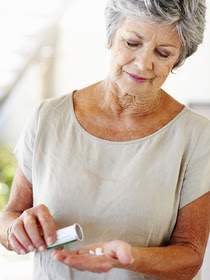 Woman looking at medication