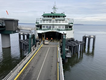 Ferry crewmembers and terminal employees working while a ferry is in dock