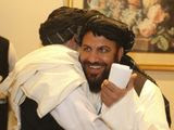 Afghanistan&#39;s Taliban delegation congratulate each other as they arrive for the agreement signing between Taliban and U.S. officials in Doha, Qatar, Saturday, Feb. 29, 2020. The United States is poised to sign a peace agreement with Taliban militants on Saturday aimed at bringing an end to 18 years of bloodshed in Afghanistan and allowing U.S. troops to return home from America&#39;s longest war. (AP Photo/Hussein Sayed)