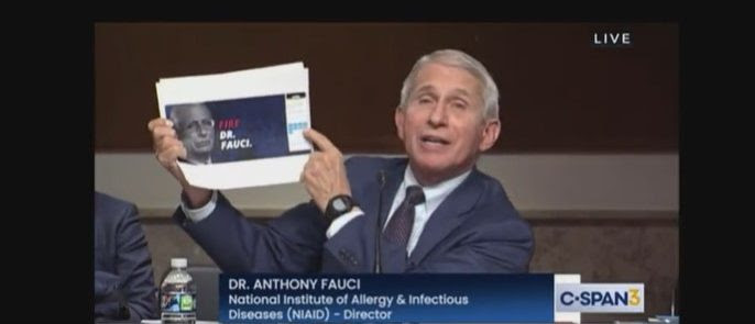 Dr. Fauci Holds Up ‘Fire Dr. Fauci’ Sign During Hearing With Sen. Rand Paul