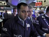 Specialist Dilip Patel, left, works at his post on the floor of the New York Stock Exchange, Monday, March 9, 2020. The Dow Jones Industrial Average sank 7.8%, its steepest drop since the financial crisis of 2008, as a free-fall in oil prices and worsening fears of fallout from the spreading coronavirus outbreak seize markets. (AP Photo/Richard Drew)